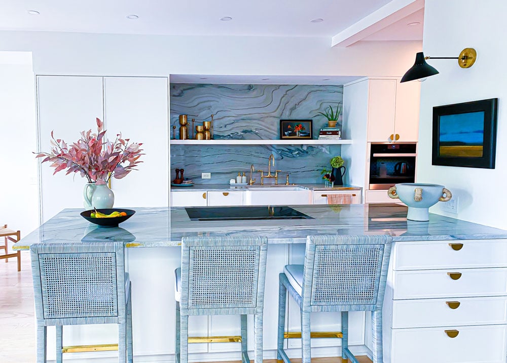 cool and pure kitchen with gold appliances