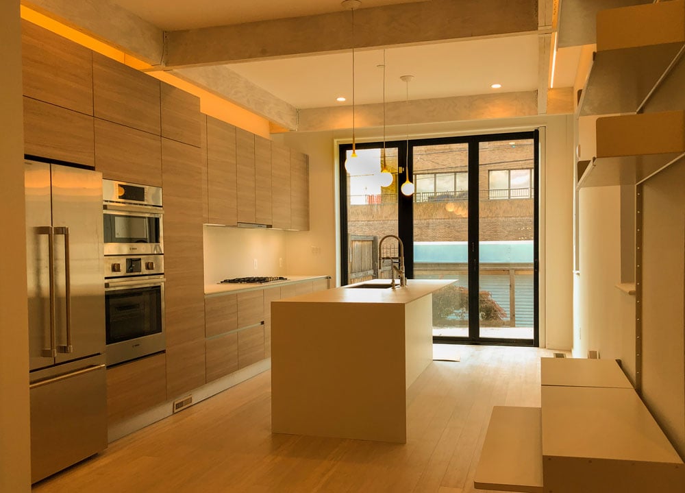 Warm and inviting kitchen remodel with yellow bulbs