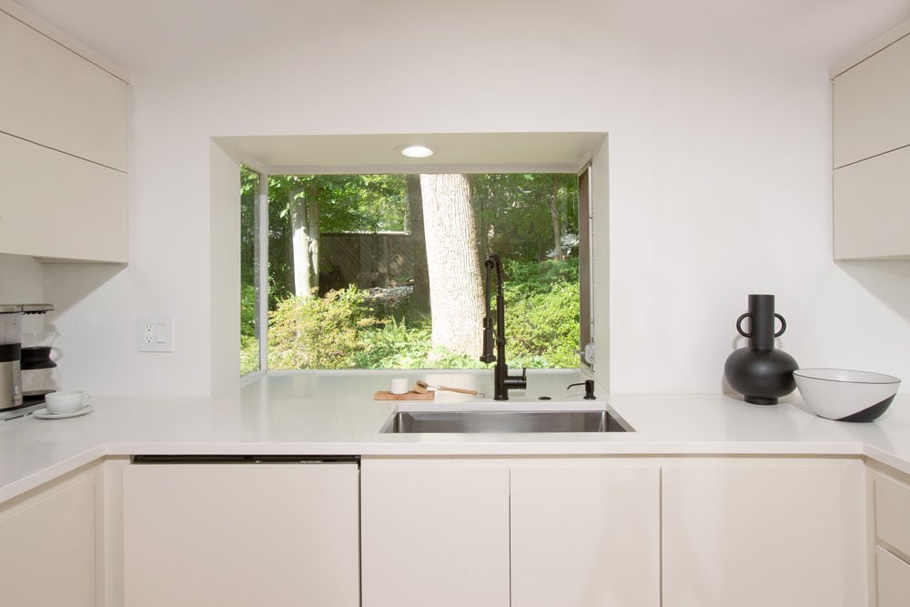 Built in dishwasher in kitchenette countertop. Open natural window