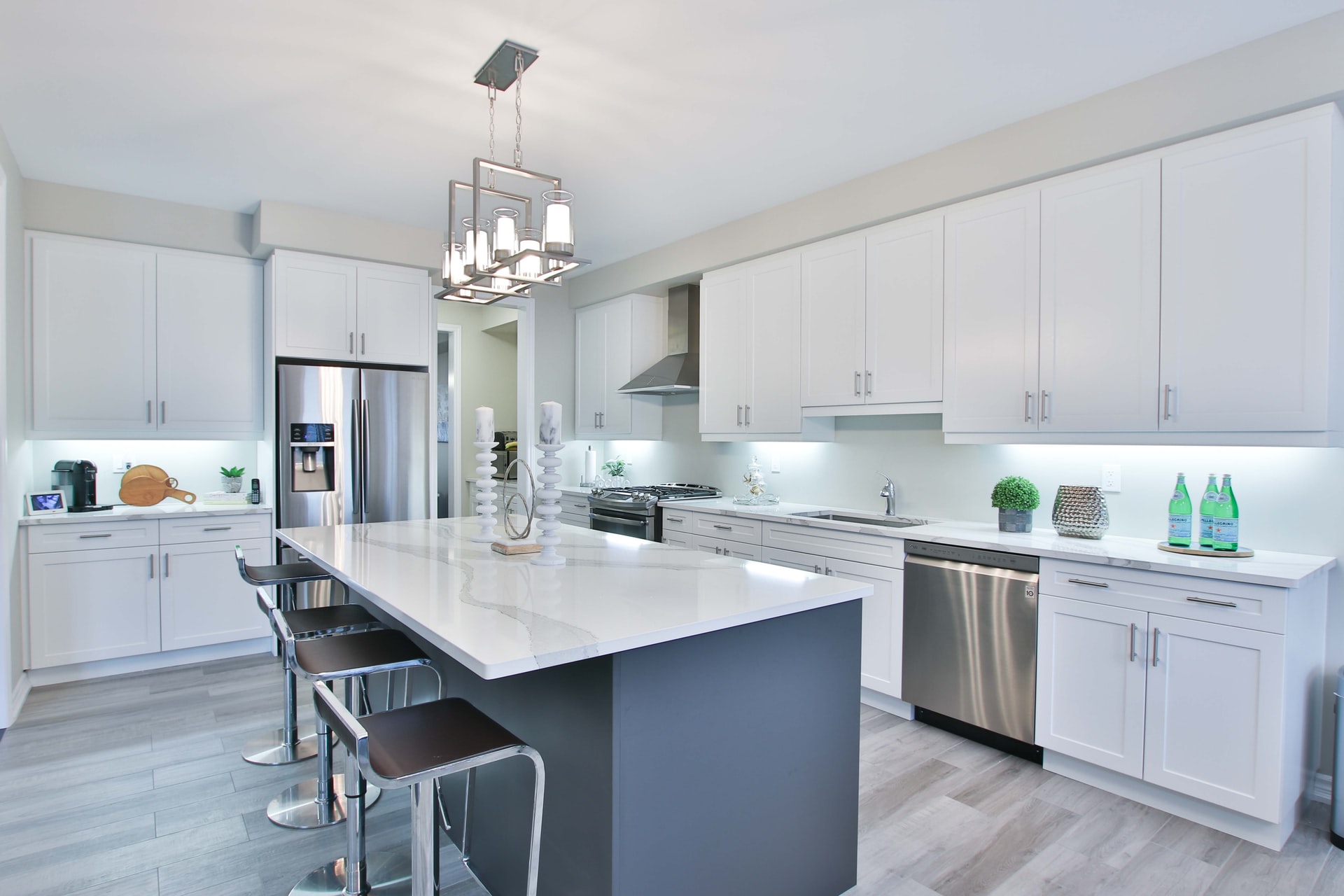Cool colors kitchen remodel with white cabinetry and navy color palette