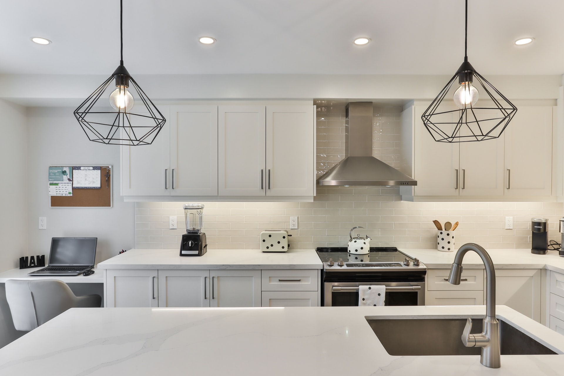 Modern and Contemporary kitchen with white cabinetry and black fixtures