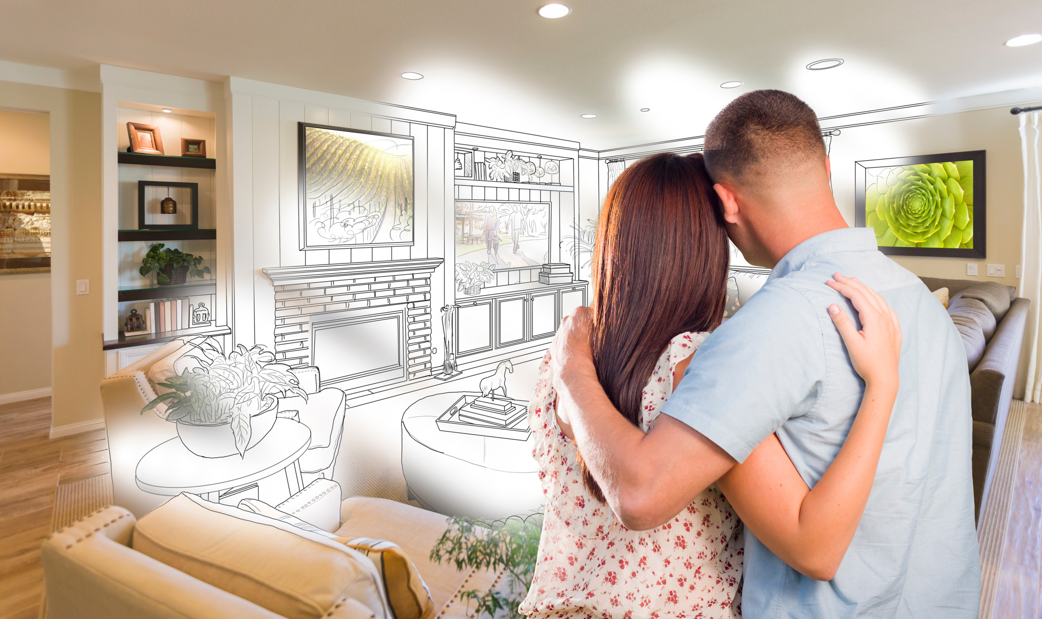 Couple of new home owners embracing as they visualize their new living room home remodeling project.